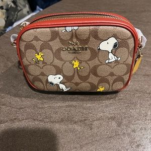Coach X Peanuts Mini Camera
Bag /Signature Canvas With Snoopy
Woodstock Print